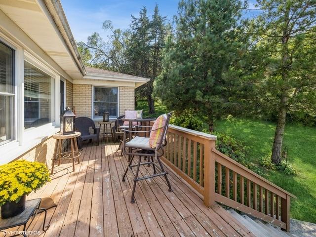 wooden deck with outdoor dining area