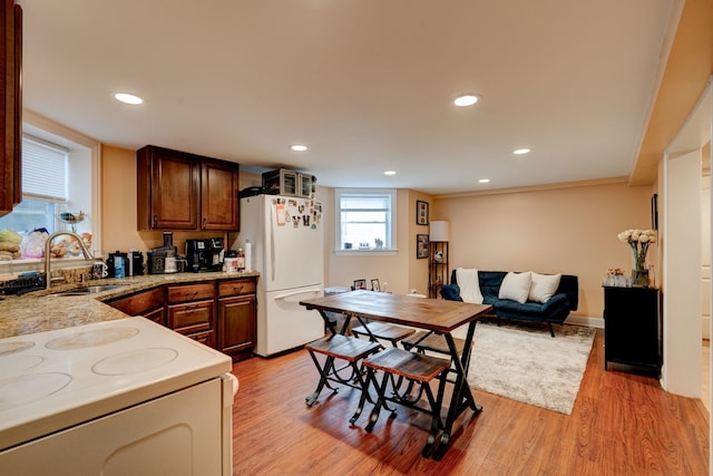 4820 W George St, Chicago, IL 60641 - kitchen with a sink, freestanding refrigerator, open floor plan, light wood-style flooring, and recessed lighting