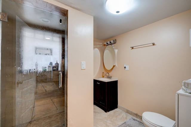4820 W George St, Chicago, IL 60641 - bathroom with a shower stall, baseboards, toilet, and vanity