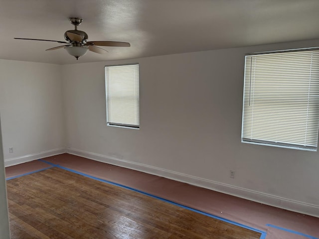 spare room with ceiling fan and a healthy amount of sunlight