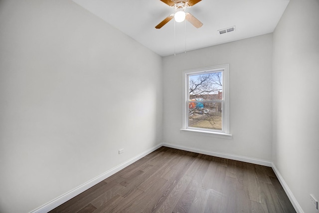 empty room featuring wood-type flooring and ceiling fan