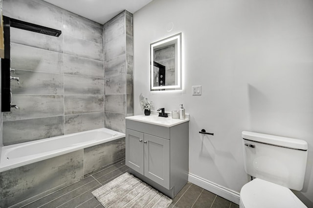 full bathroom with tiled shower / bath combo, vanity, and toilet