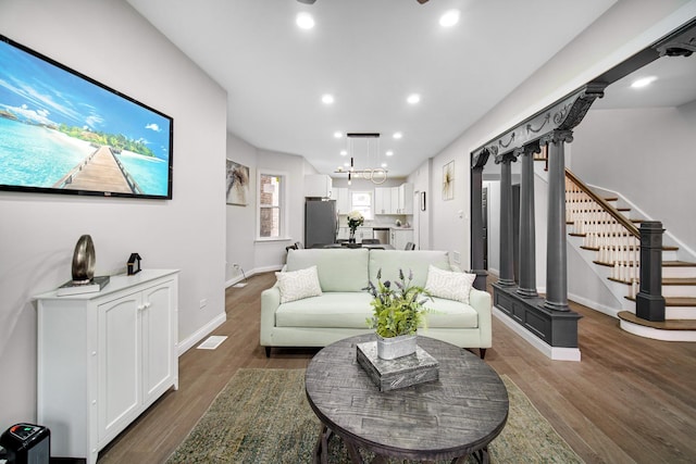 living room featuring dark wood-type flooring