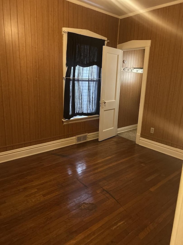 unfurnished room with dark hardwood / wood-style floors