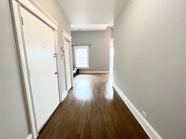 hall featuring dark wood-type flooring