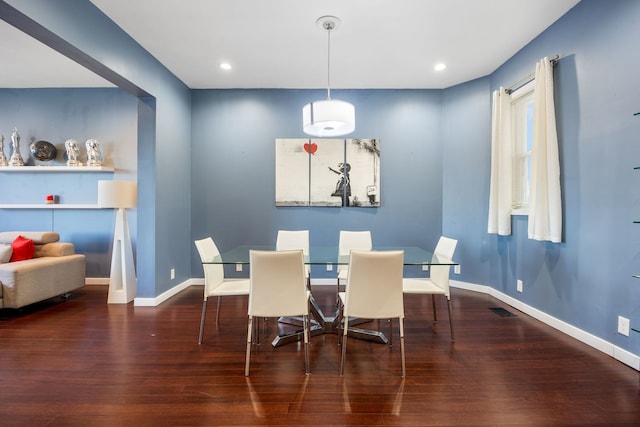 dining space featuring dark hardwood / wood-style flooring