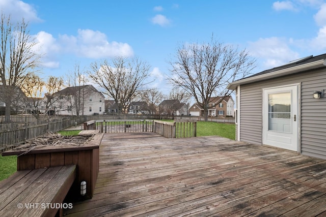 wooden deck with a lawn