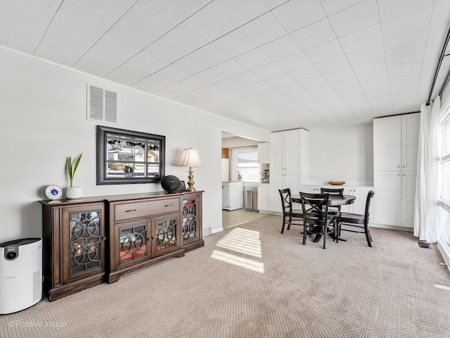 dining room with light carpet