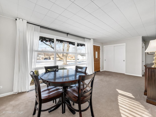 dining room with light carpet