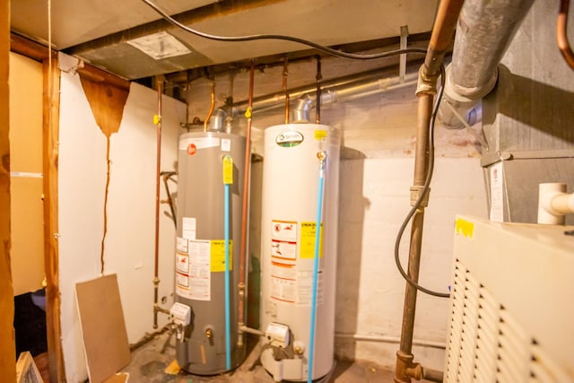 utility room featuring water heater