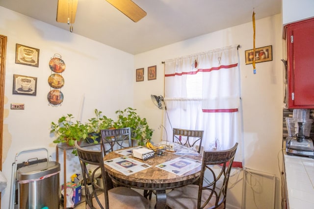 dining space featuring ceiling fan