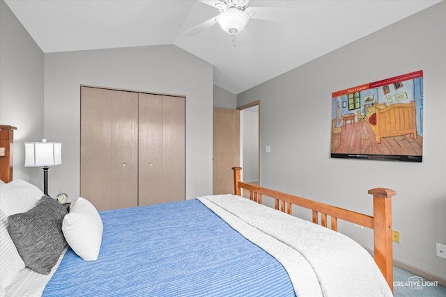 bedroom featuring lofted ceiling, ceiling fan, and a closet