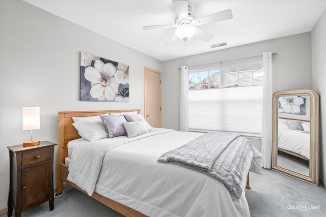 bedroom featuring light carpet and ceiling fan