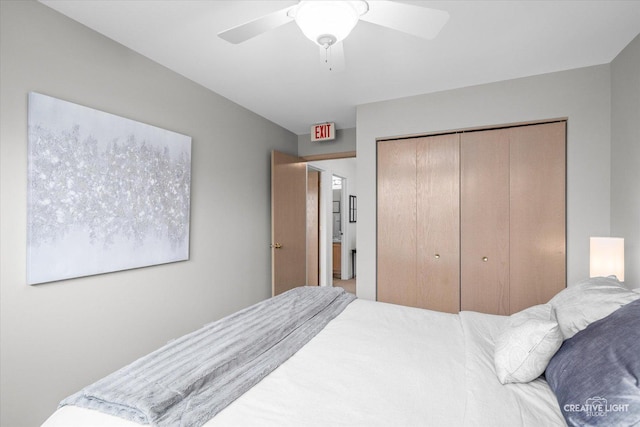 bedroom with ceiling fan and a closet