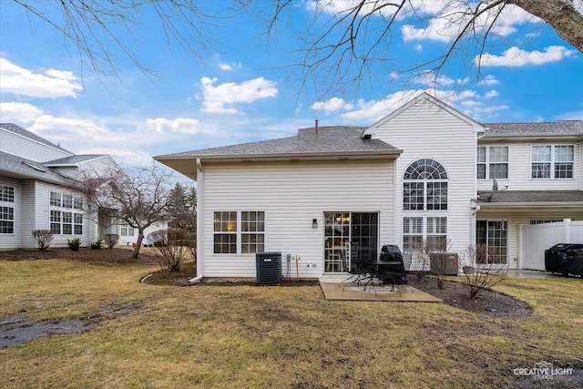 back of property featuring cooling unit, a yard, and a patio area