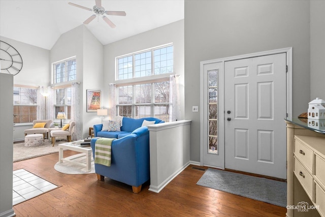 foyer featuring ceiling fan, wood-type flooring, and high vaulted ceiling