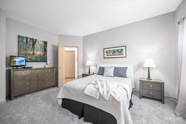 bedroom featuring light carpet