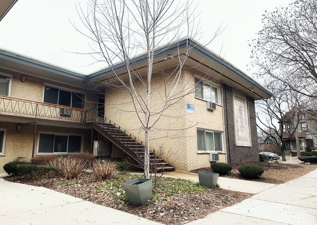 view of side of home with a balcony