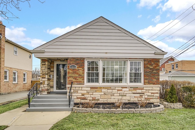 bungalow with a front lawn