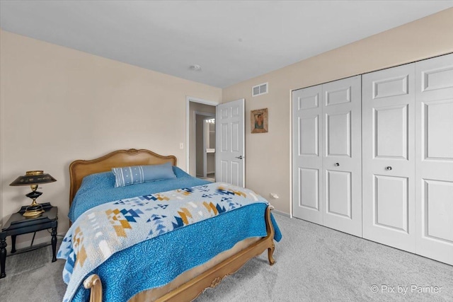 carpeted bedroom with a closet