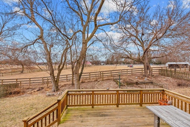 wooden terrace featuring a rural view