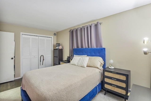 bedroom featuring hardwood / wood-style floors and a closet