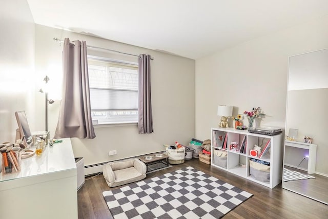 rec room featuring dark hardwood / wood-style floors and baseboard heating