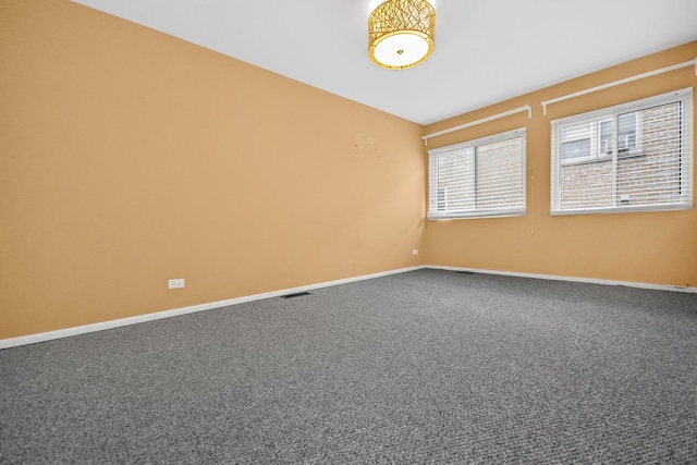 unfurnished room featuring carpet flooring