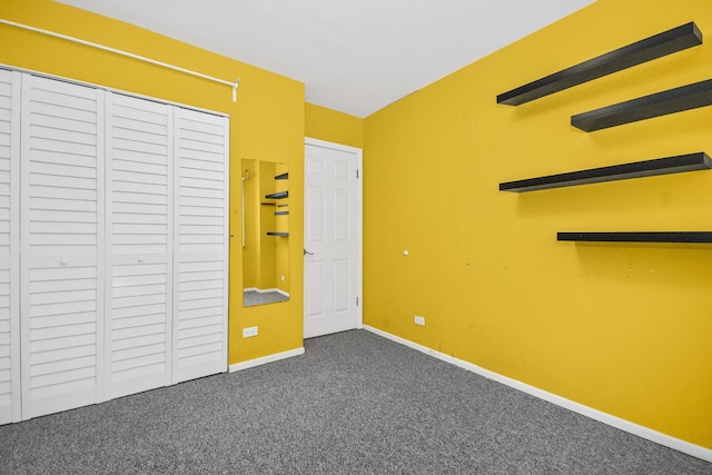 unfurnished bedroom featuring carpet floors and a closet