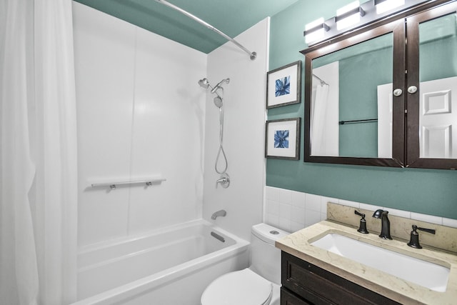 full bathroom featuring shower / bath combo, vanity, and toilet