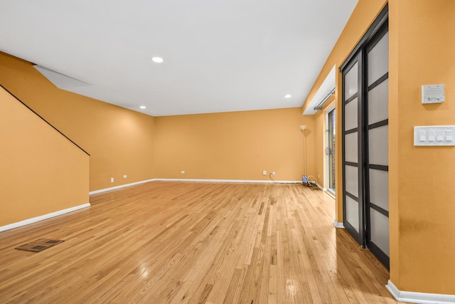 unfurnished room with light hardwood / wood-style flooring