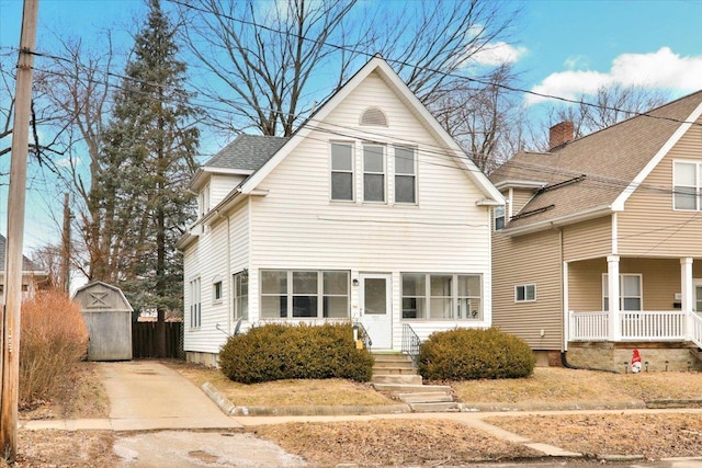 front of property with a shed