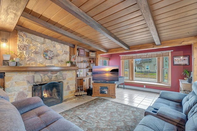 living room featuring light tile patterned flooring, a fireplace, beamed ceiling, a baseboard radiator, and wooden ceiling