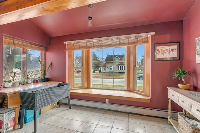 interior space with lofted ceiling, light tile patterned floors, and baseboard heating