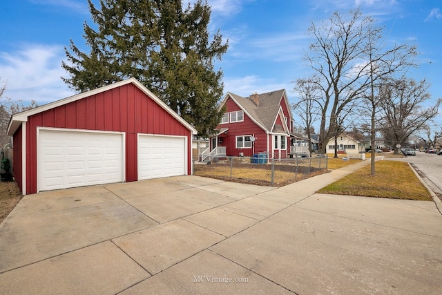 exterior space with an outbuilding and a garage