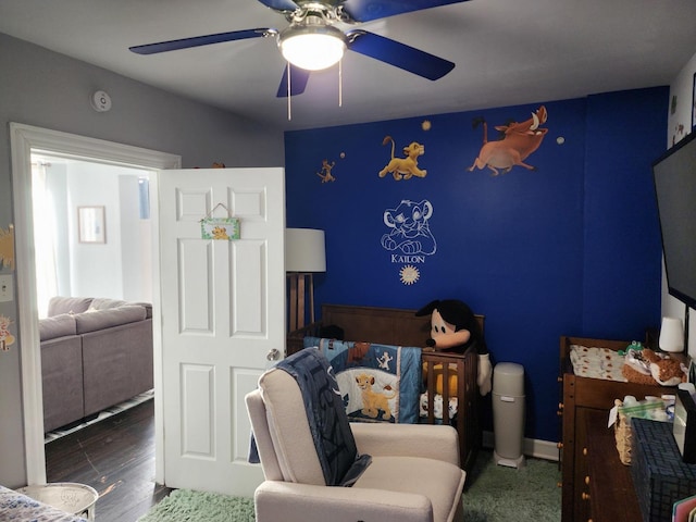 bedroom featuring dark hardwood / wood-style floors and ceiling fan