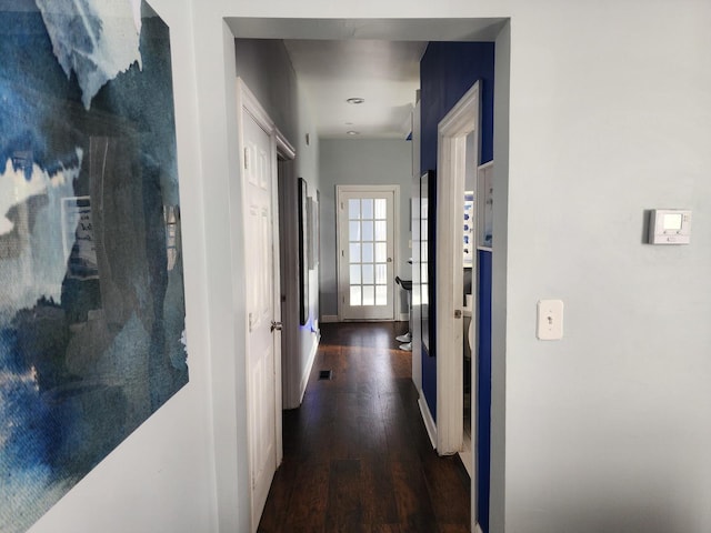 corridor featuring dark hardwood / wood-style floors