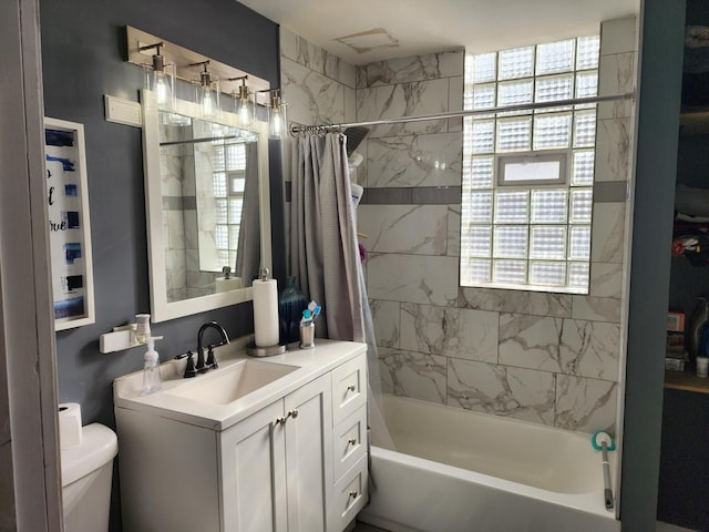 full bathroom with vanity, toilet, and shower / bath combo