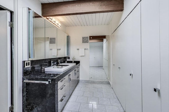 bathroom featuring tile patterned flooring, visible vents, beamed ceiling, and vanity