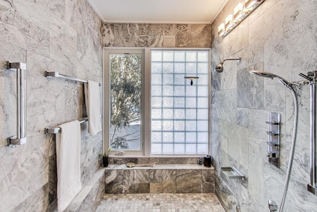 bathroom with ornamental molding and a tile shower