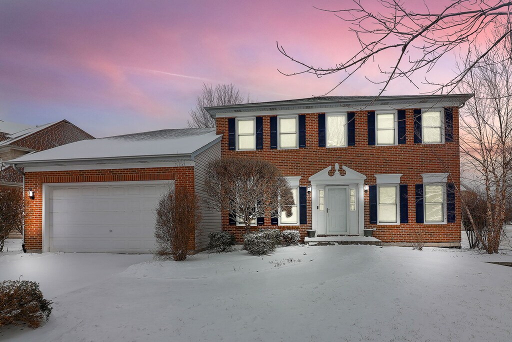 colonial-style house with a garage