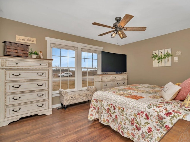 bedroom featuring ceiling fan and dark hardwood / wood-style flooring