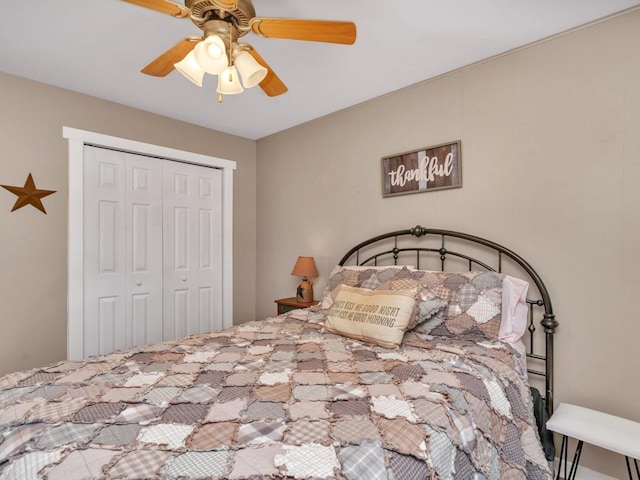 bedroom featuring ceiling fan and a closet