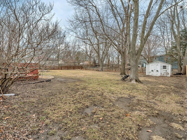 view of yard featuring a storage unit