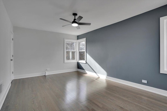 unfurnished room with hardwood / wood-style flooring and ceiling fan