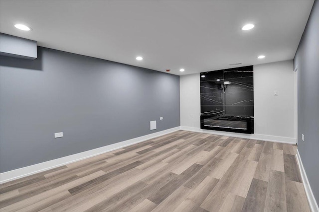 spare room featuring light wood-type flooring