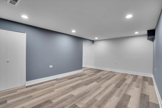 basement featuring light hardwood / wood-style floors