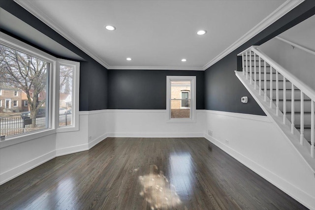 empty room with crown molding and dark hardwood / wood-style floors