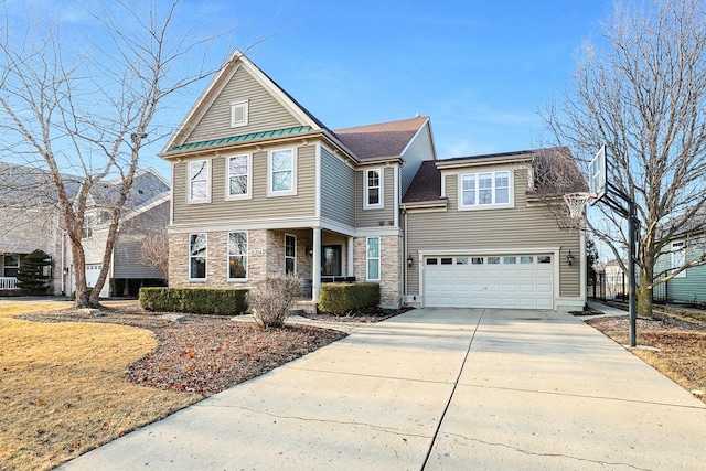 view of front of house with stone siding and concrete driveway