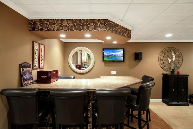 bar featuring ornamental molding, a dry bar, and recessed lighting